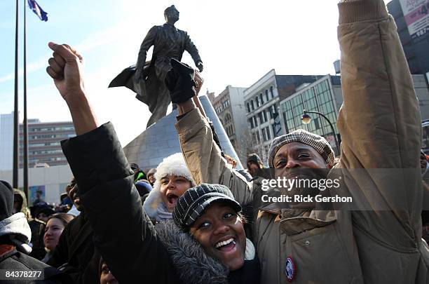 Al Smith and his daughter Monique Smith celebrate while watching the inauguration of Barack Obama as the 44th president of the United States on a...