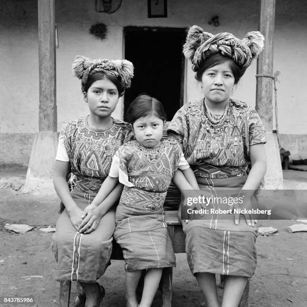 Woman poses with her 12-year-old daughter Josefa Cedillo Marcos and 6-year-old neice Juana Cedillo Perez, Nebaj, Guatemala, January 1984. Marcos and...