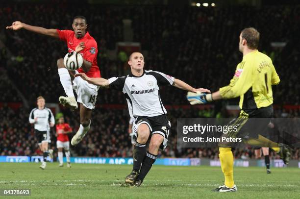 Danny Welbeck of Manchester United clashes with Roy Carroll of Derby County during the Carling Cup Semi-Final 2nd Leg match between Manchester United...