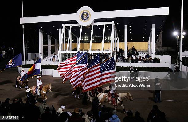 Parade participants on horseback ride past the Presidential Reviewing Stand as US President Barack Obama and First Lady Michelle Obama watch the...