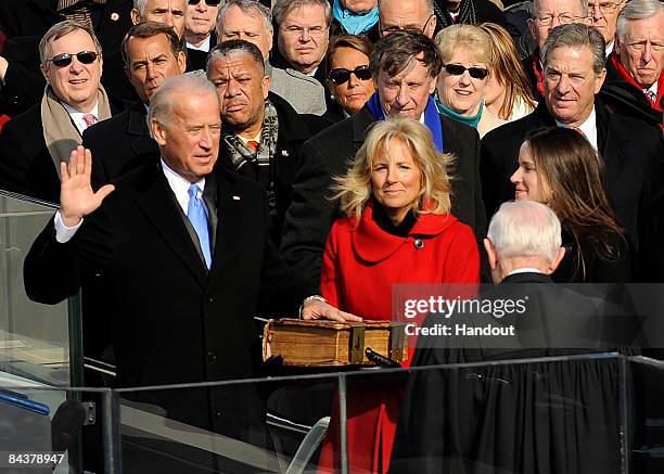 Joe Biden, with wife Jill Biden by his side, is sworn in as the vice president of the United States by U.S. Supreme Court Associate Justice John Paul...