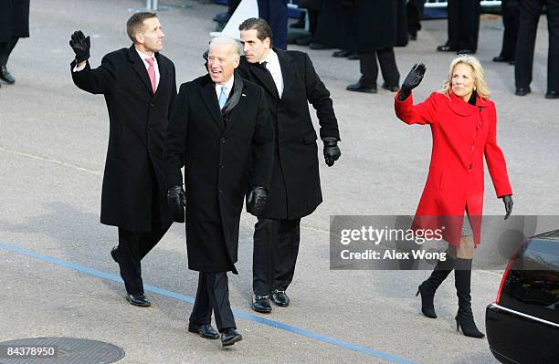 Vice-President Joe Biden arrives with his family, wife Jill, sons Hunter and Beau at the reviewing stand to watch the Inaugural Parade from in front...