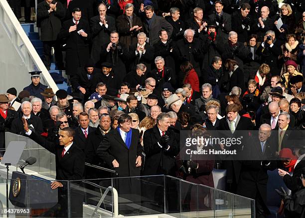 President Barack Obama waves to the crowd before giving his inaugural address after taking the oath of office at the U.S. Capitol January 20, 2009 in...