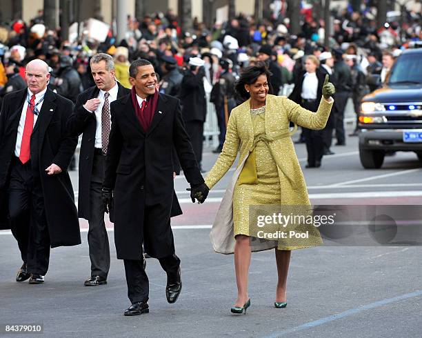 President Barack Obama and first lady Michelle Obama walk in the Inaugural Parade on January 20, 2009 in Washington, DC. Obama was sworn in as the...