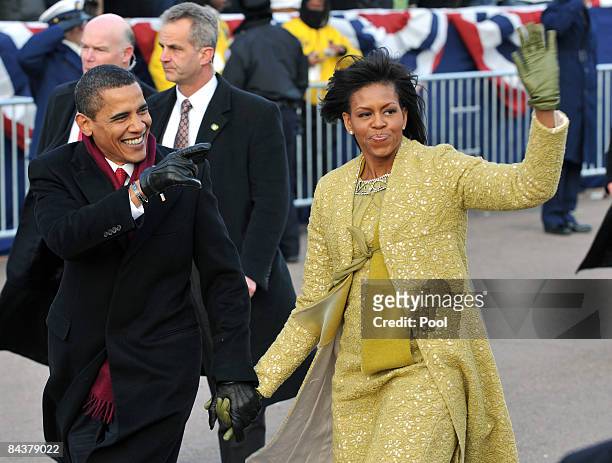 President Barack Obama and first lady Michelle Obama walk in the Inaugural Parade on January 20, 2009 in Washington, DC. Obama was sworn in as the...