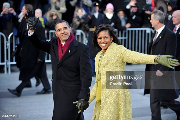 President Barack Obama and first lady Michelle Obama walk in the Inaugural Parade on January 20, 2009 in Washington, DC. Obama was sworn in as the...