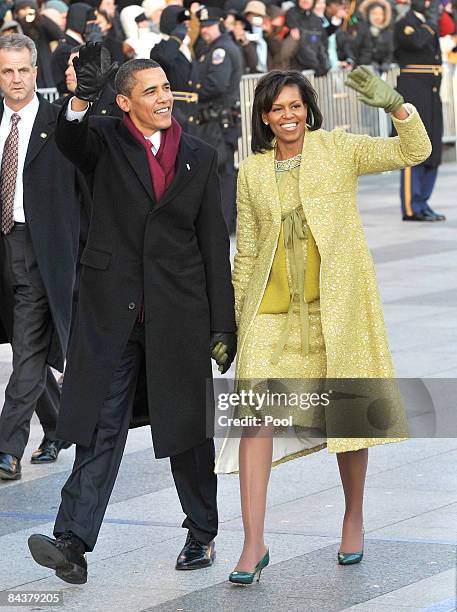 President Barack Obama and first lady Michelle Obama walk in the Inaugural Parade on January 20, 2009 in Washington, DC. Obama was sworn in as the...