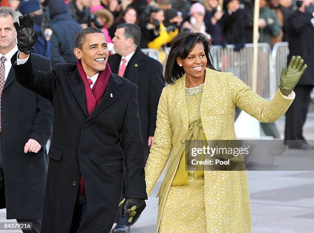 President Barack Obama and first lady Michelle Obama walk in the Inaugural Parade on January 20, 2009 in Washington, DC. Obama was sworn in as the...