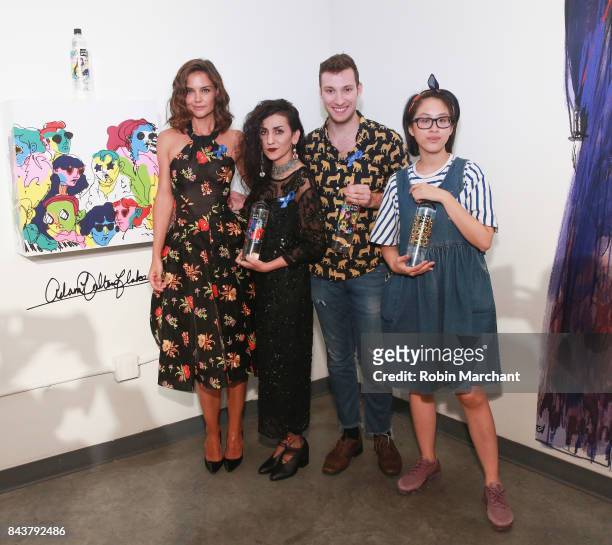 Katie Holmes poses with designers Ghazaleh Khalifeh, Adam Dalton Blake and Tiffany Huang at their fashion show during New York Fashion Week on...
