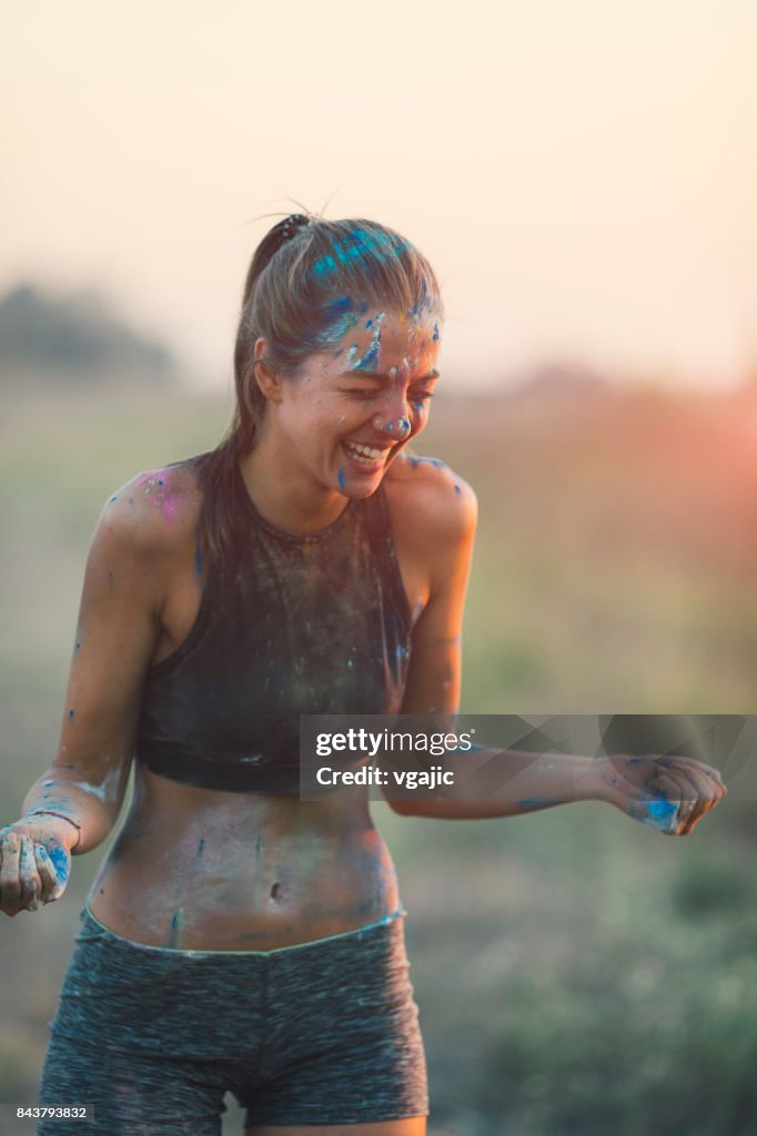 Marathon Racer Throwing Holi Colors