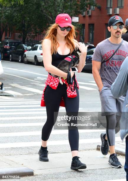 Model Joe Jonas and Sophie Turner walk their dog in soho on September 7, 2017 in New York City.