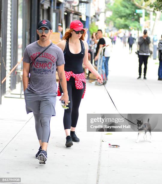 Model Joe Jonas and Sophie Turner walk their dog in soho on September 7, 2017 in New York City.