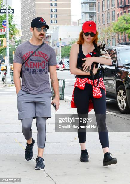 Model Joe Jonas and Sophie Turner walk their dog in soho on September 7, 2017 in New York City.