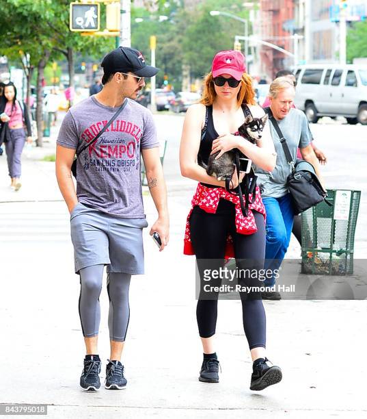 Model Joe Jonas and Sophie Turner walk their dog in soho on September 7, 2017 in New York City.