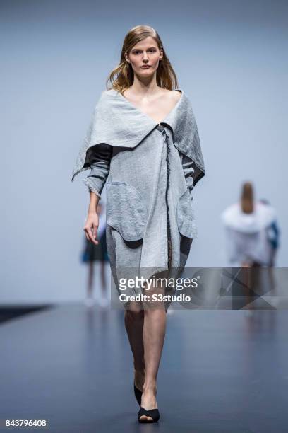 Model showcases designs by Ayako Yoshida on the runway during the Redress: The EcoChic Design Award 2017: Grand Final Fashion Show on the Day 2 of...