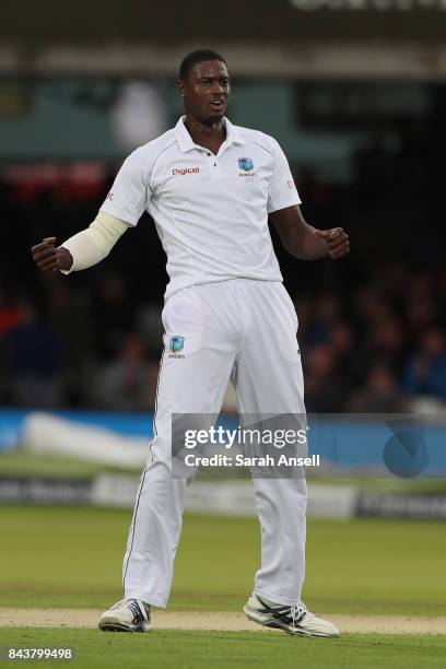 Jason Holder of West Indies celebrates after taking the wicket of England's Tom Westley during day one of the 1st Investec Test match between England...