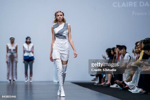 Model showcases designs by Claire Dartigues on the runway during the Redress: The EcoChic Design Award 2017: Grand Final Fashion Show on the Day 2 of...