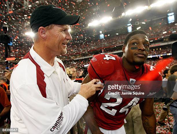 Head coach Ken Whisenhunt of the Arizona Cardinals celebrates with safety Adrian Wilson after winning the NFC championship game against the...