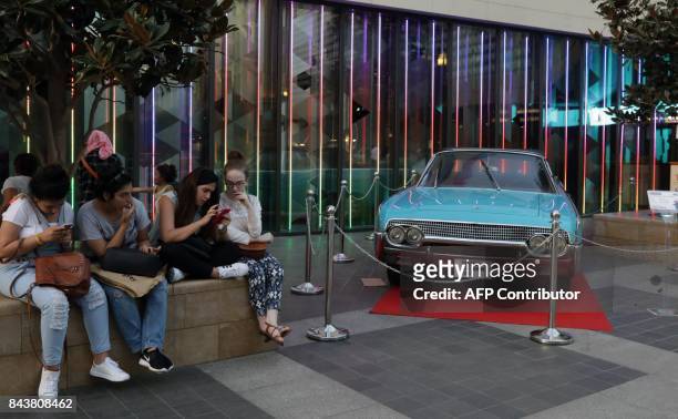 Picture taken on September 7, 2017 shows a four-seater convertible 1962 Lincoln Continental vintage car on display during the third edition of the...