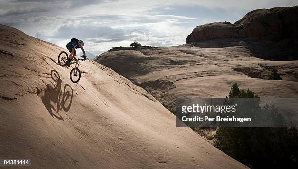 mountain biking on slickrock - extreme sports ストックフォトと画像