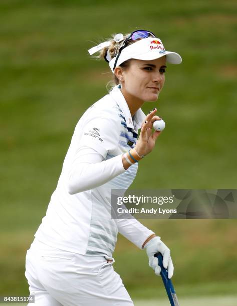 Lexi Thompson waves to the crowd after making a birdie on the 9th hole during the first round of the Indy Women In Tech Championship-Presented By...