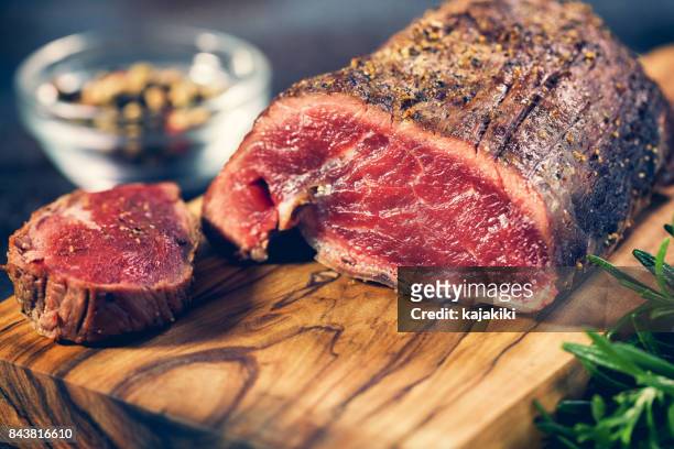 juicy beef steak - rare stock pictures, royalty-free photos & images