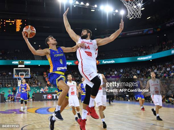 Bojan Dubljevic of Hungary vies with Radu Paliciuc of Spain during Group C FIBA Eurobasket 2017 mens basketball match between Montenegro and Romania...