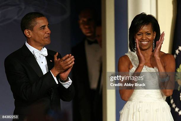 President Barack Obama and his wife Michelle Obama arrive on stage duringduring MTV & ServiceNation: Live From The Youth Inaugural Ball at the Hilton...