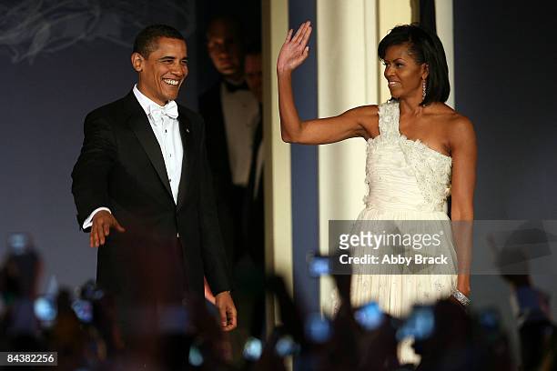 President Barack Obama and his wife Michelle Obama arrive on stage duringduring MTV & ServiceNation: Live From The Youth Inaugural Ball at the Hilton...