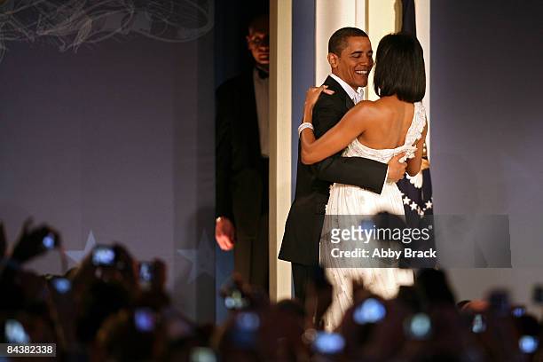 President Barack Obama and his wife First Lady Michelle Obama dance on stage during MTV & ServiceNation: Live From The Youth Inaugural Ball at the...