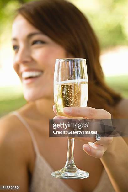 woman toasting champagne and laughing - brown hair drink wine stock pictures, royalty-free photos & images