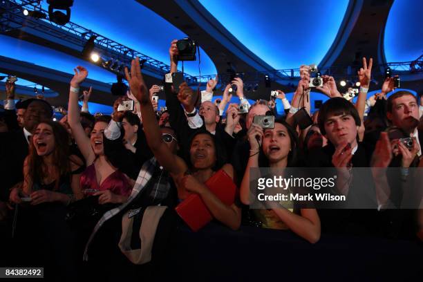 People take pictures of U.S President Barack Obama as he arrives on stage duringduring MTV & ServiceNation: Live From The Youth Inaugural Ball at the...