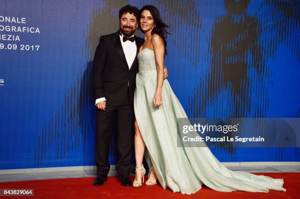 Giglia Marra and Federico Zampaglione walk the red carpet ahead of the 'Manuel' screening during the 74th Venice Film Festival at Sala Giardino on...