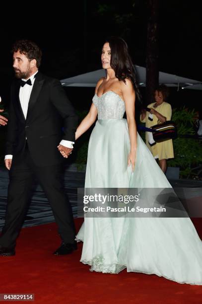 Giglia Marra and Federico Zampaglione walk the red carpet ahead of the 'Manuel' screening during the 74th Venice Film Festival at Sala Giardino on...