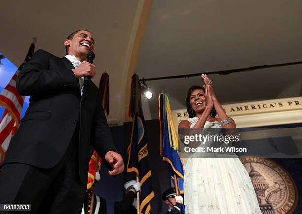 President Barack Obama speaks as his wife First Lady Michelle Obama looks on during MTV & ServiceNation: Live From The Youth Inaugural Ball at the...