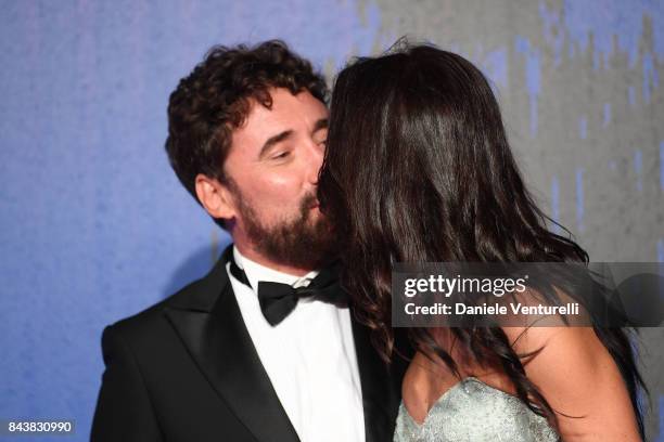 Giglia Marra and Federico Zampaglione walk the red carpet ahead of the 'Manuel' screening during the 74th Venice Film Festival at Sala Giardino on...