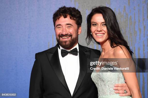 Giglia Marra and Federico Zampaglione walk the red carpet ahead of the 'Manuel' screening during the 74th Venice Film Festival at Sala Giardino on...