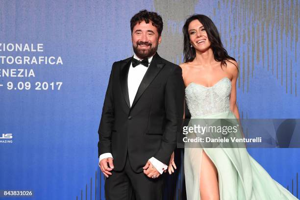 Giglia Marra and Federico Zampaglione walk the red carpet ahead of the 'Manuel' screening during the 74th Venice Film Festival at Sala Giardino on...
