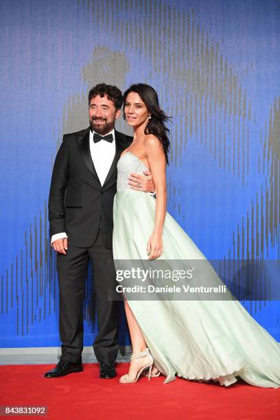 Giglia Marra and Federico Zampaglione walk the red carpet ahead of the 'Manuel' screening during the 74th Venice Film Festival at Sala Giardino on...