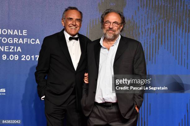 Festival director Alberto Barbera and Angelo Barbagallo walk the red carpet ahead of the 'Manuel' screening during the 74th Venice Film Festival at...