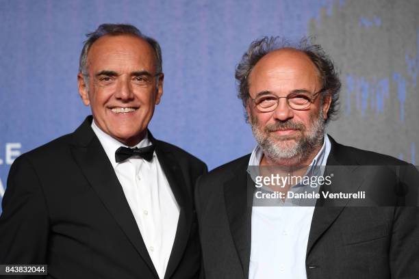 Festival director Alberto Barbera and Angelo Barbagallo walk the red carpet ahead of the 'Manuel' screening during the 74th Venice Film Festival at...