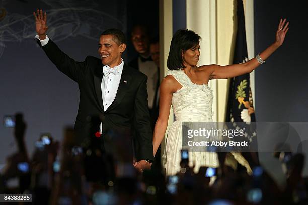 President Barack Obama and his wife First Lady Michelle Obama arrive on stage during MTV & ServiceNation: Live From The Youth Inaugural Ball at the...