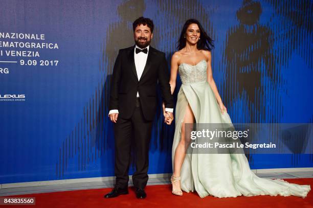 Giglia Marra and Federico Zampaglione walk the red carpet ahead of the 'Manuel' screening during the 74th Venice Film Festival at Sala Giardino on...