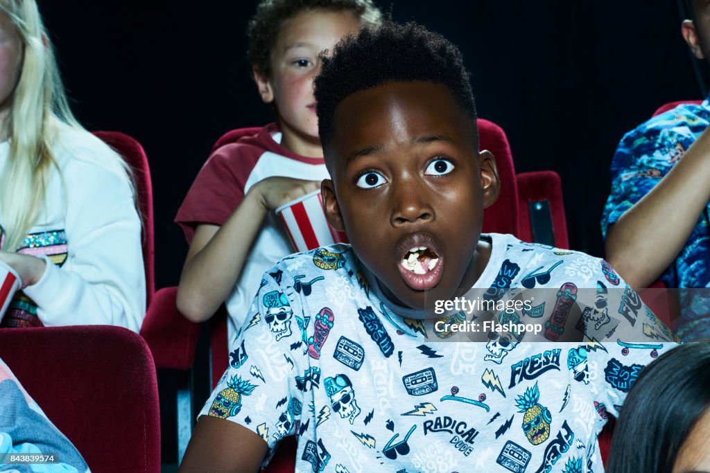Group of children enjoying a movie at the cinema