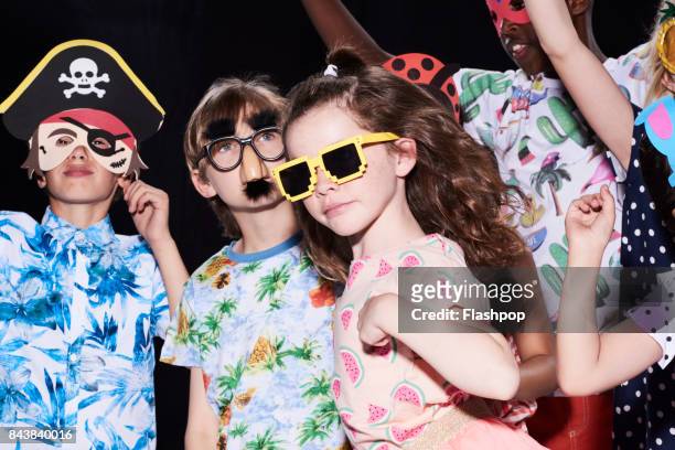 group of children having fun at a party - sunglasses disguise imagens e fotografias de stock