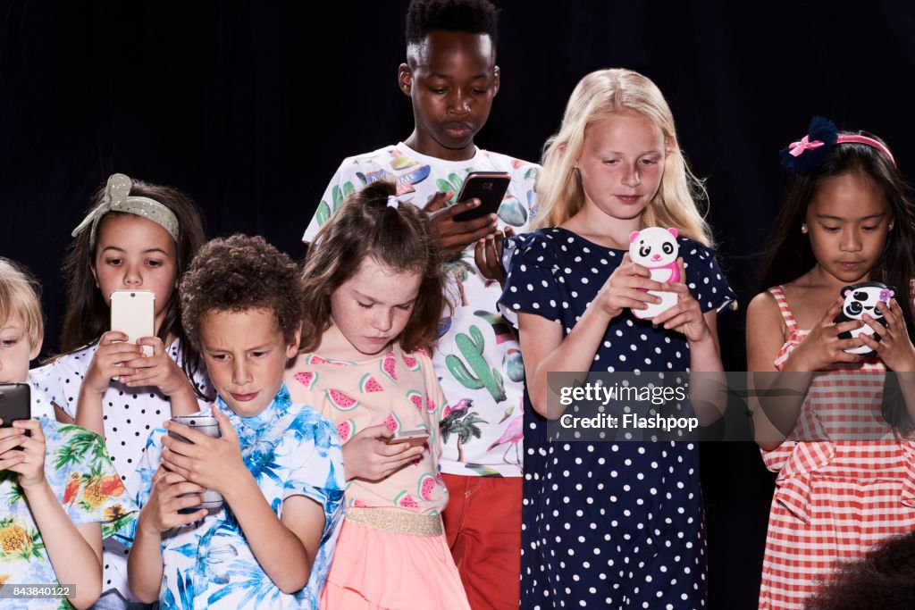 Group of friends using their phones