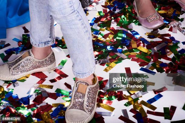 group of children having fun at a party - goldene schuhe stock-fotos und bilder