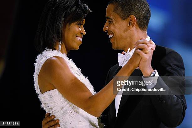 President Barack Obama dances with his wife and First Lady Michelle Obama during the Western Inaugural Ball on January 20, 2009 in Washington, DC....