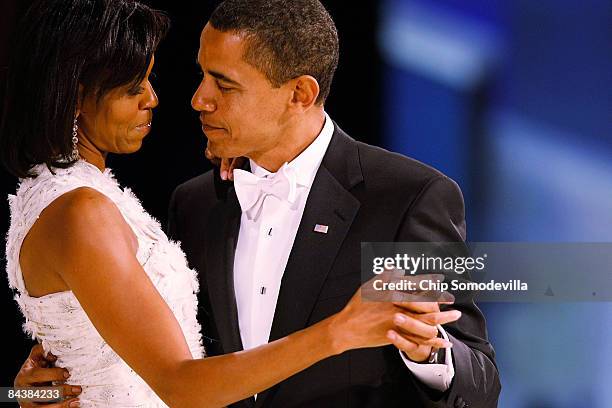 President Barack Obama dances with his wife and First Lady Michelle Obama during the Western Inaugural Ball on January 20, 2009 in Washington, DC....