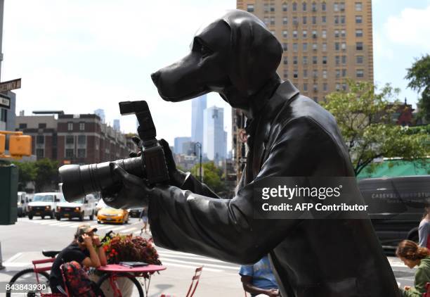 Sculpture called the " Paparazzi Dogs" created by Australian husband and wife team of Gillie and Marc on the corner at the intersection of Greenwich...